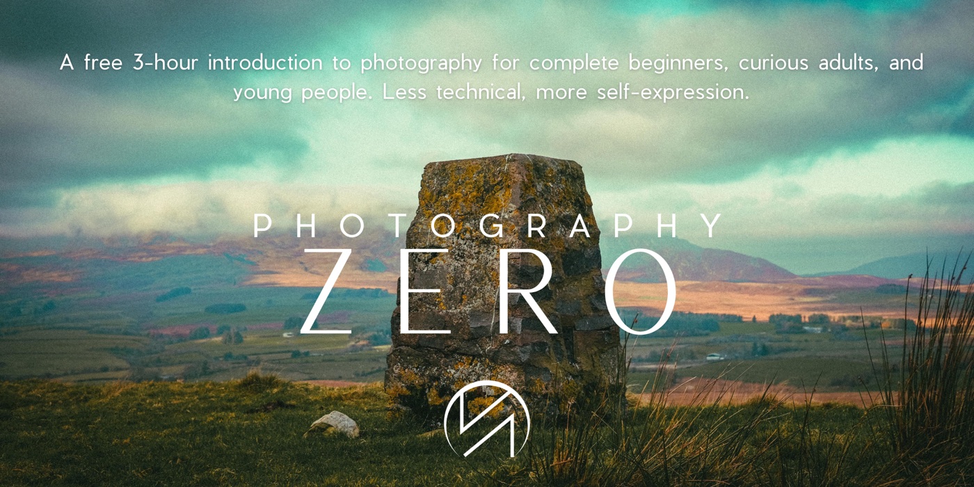 Photography Zero workshop banner with a stone trig point overlooking hills