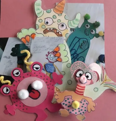 Colourful paper monsters with googly eyes and craft decorations