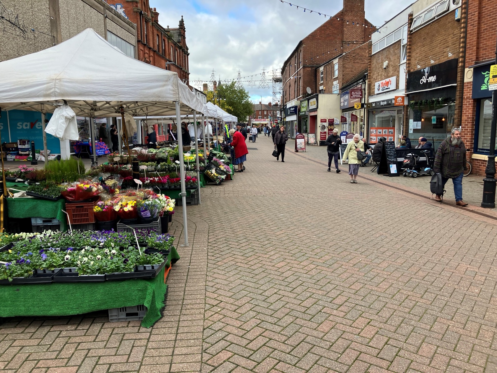 Market stalls and shoppers on Long Eaton High Street